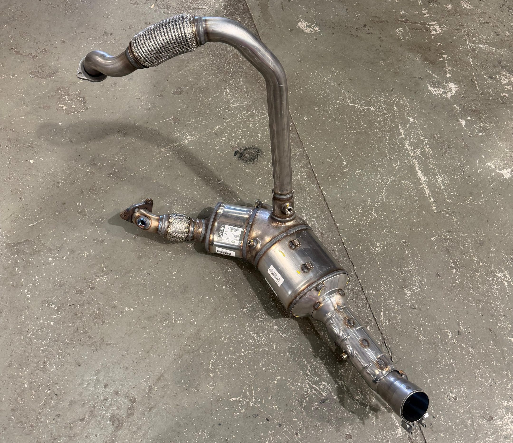 Diesel particulate filter and exhaust assembly removed from a vehicle for servicing